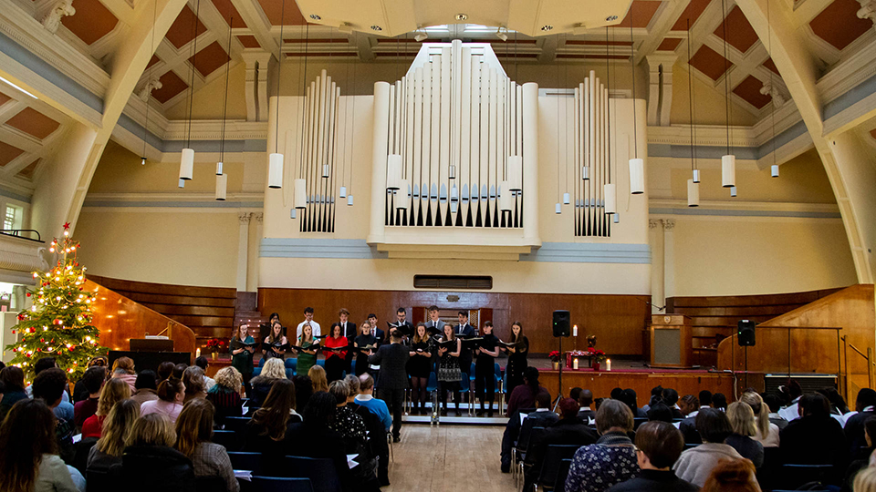 The goldsmiths choir performs in the Great Hall