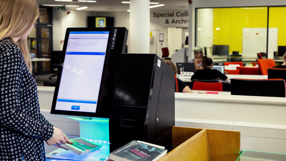 Automated machines for checking out and returning books