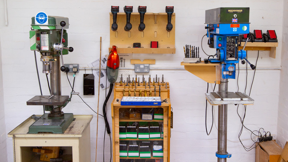 A drill press station in the woodwork lab