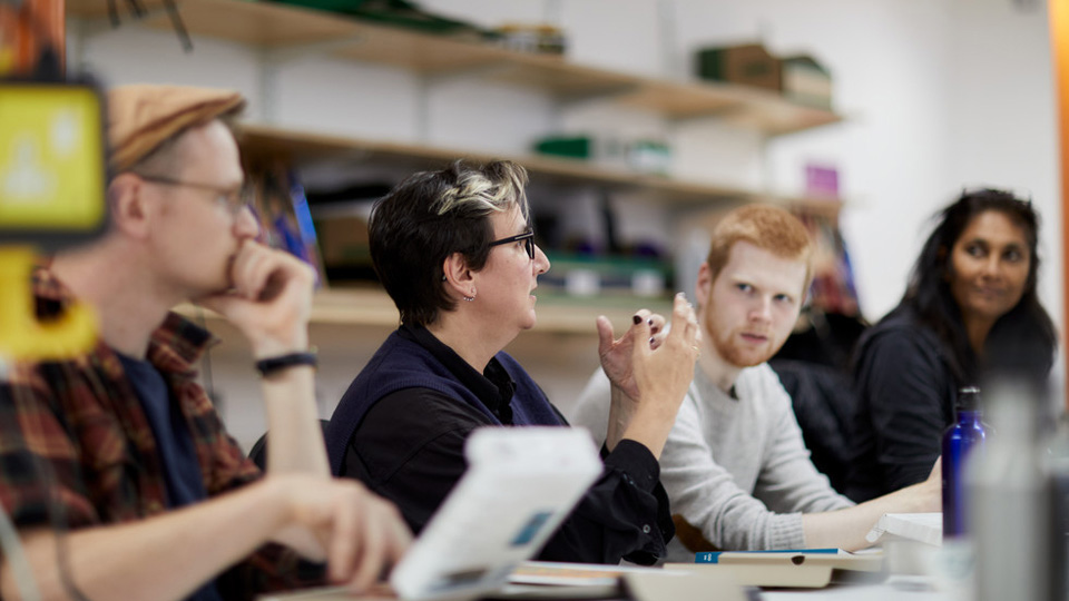 A seminar being lead in a Design workspace