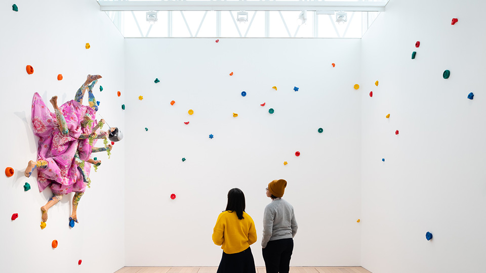 Two people looking an abstract exhibition inside the CCA