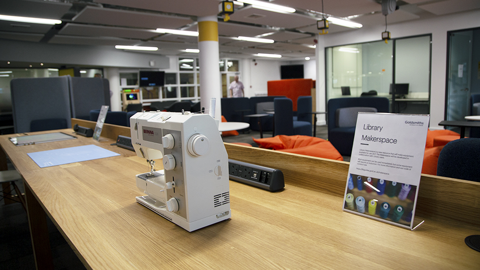 A sewing machine and other equipment on a table in the Library