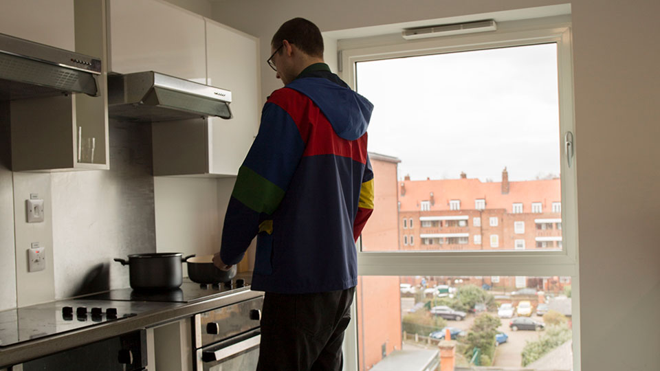 A student using a kitchen space in Town Hall Camberwell